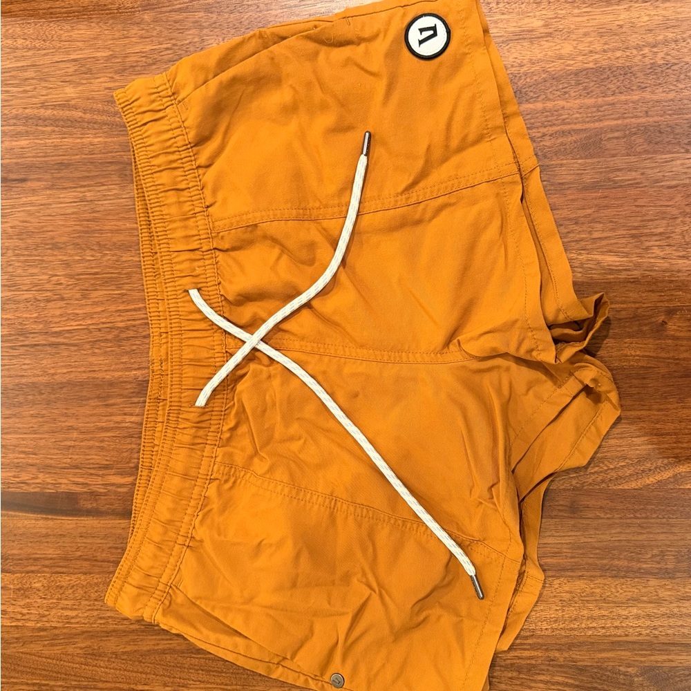 Vuori Athletic Shorts in Orange